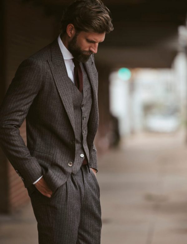 A custom charcoal pinstripe suit